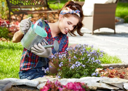 Worker wearing PPE during landscaping work in Wembley