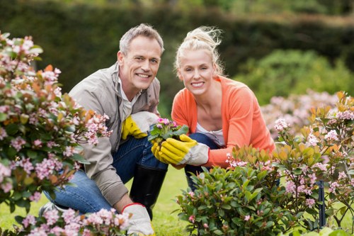 Worker using protective equipment with garden tools
